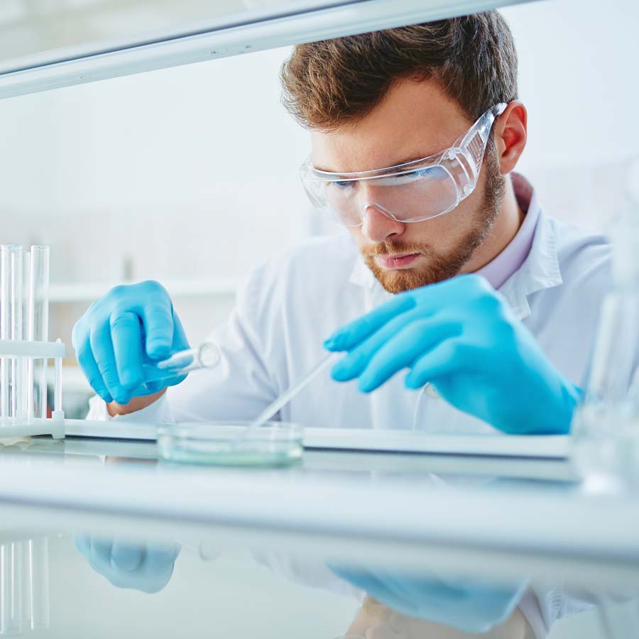 Researcher doing In Vitro antimicrobial testing.